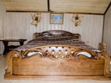 Різьблені ліжка (44 фото): моделі з масиву дерева, з різьбленим узголів’ям, дерев’яні двоспальні і односпальні моделі з різьбленням, дитячі ліжка