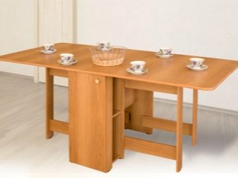 Розкладний обідній стіл-книжка для вітальні: як вибрати вузький стіл-трансформер для залу круглої і квадратної форми?