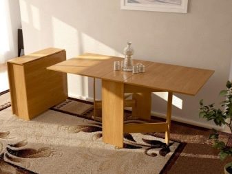 Розкладний обідній стіл-книжка для вітальні: як вибрати вузький стіл-трансформер для залу круглої і квадратної форми?