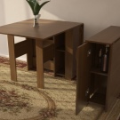 Розкладний обідній стіл-книжка для вітальні: як вибрати вузький стіл-трансформер для залу круглої і квадратної форми?