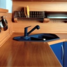 Стільниці з ДСП для кухні (39 фото): ламіновані вироби товщиною 28-38 мм, розміри кухонних стільниць з ЛДСП. Що таке постформінг?