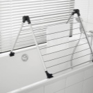 Сушарки для білизни у ванну кімнату: настінні і стельові, мотузки для сушіння і складні, ліани і вішалки. Особливості опускаються і розсувних моделей