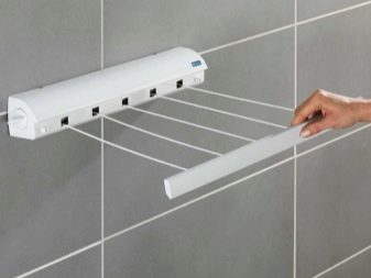 Сушарки для білизни у ванну кімнату: настінні і стельові, мотузки для сушіння і складні, ліани і вішалки. Особливості опускаються і розсувних моделей