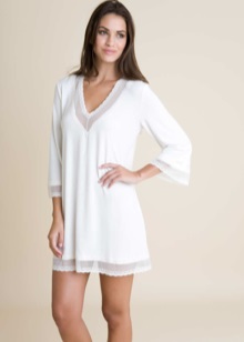 Трикотажні туніки (176 фото): фасони жіночих тунік з трикотажу, турецькі туніки, ошатні, домашні, з довгим рукавом