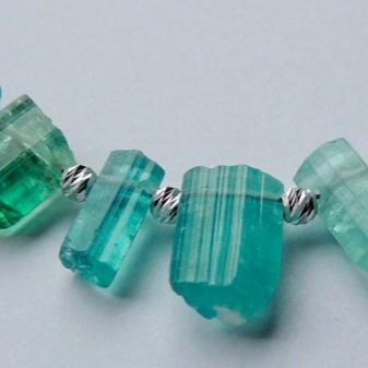 Турмалін (57 фото): лікувальні та інші властивості каменю, його значення для людини. Дія мінералу на організм. Опис зеленого каменю і турмаліну інших кольорів