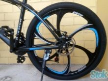 Велосипед на литих дисках (35 фото): плюси і мінуси лиття замість спиць, велосипедні диски Green Bike і Porsche, Audi і Ferrari, відгуки власників