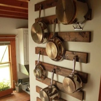 Зберігання сковорідок: вибір підставки. Опис органайзерів і тримачів для зберігання сковорідок на кухні