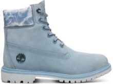 Жіноча зимова взуття Timberland (42 фото): черевики на натуральному хутрі, теплі кросівки та інші. З чим носити їх дівчатам взимку?