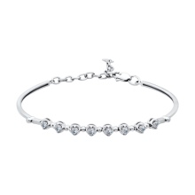 Жіночий браслет з білого золота (78 фото): моделі з жовтим металом з топазами і сапфірами, тонкі і товсті на руку, від Тіффані