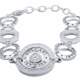 Жіночий браслет з білого золота (78 фото): моделі з жовтим металом з топазами і сапфірами, тонкі і товсті на руку, від Тіффані