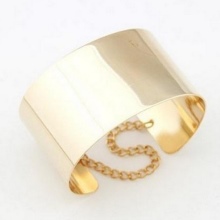 Жорсткий браслет із золота (81 фото): жіночі плоскі моделі на руку з жовтого золота 585 проби, відгуки