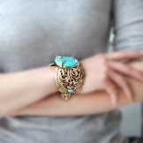 Жорсткий браслет із золота (81 фото): жіночі плоскі моделі на руку з жовтого золота 585 проби, відгуки