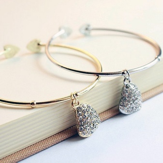 Жорсткий браслет із золота (81 фото): жіночі плоскі моделі на руку з жовтого золота 585 проби, відгуки