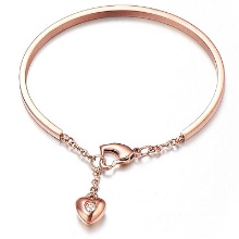 Жорсткий браслет із золота (81 фото): жіночі плоскі моделі на руку з жовтого золота 585 проби, відгуки