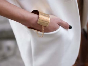 Жорсткий браслет із золота (81 фото): жіночі плоскі моделі на руку з жовтого золота 585 проби, відгуки