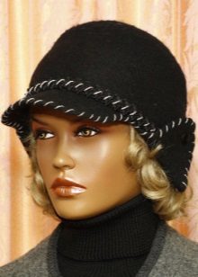 Зимова кепка (71 фото): жіночі хутряні моделі з козирком, бейсболки, з одворотом і вушками, в’язана, з нерпи та шкіри